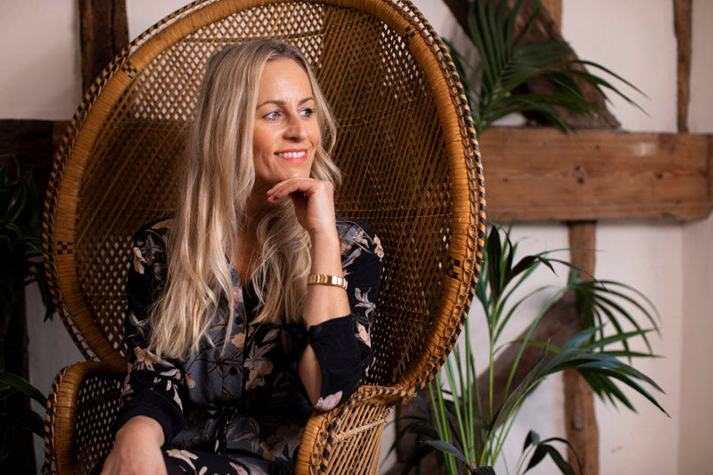 Women in chair Bio Mag Smiling